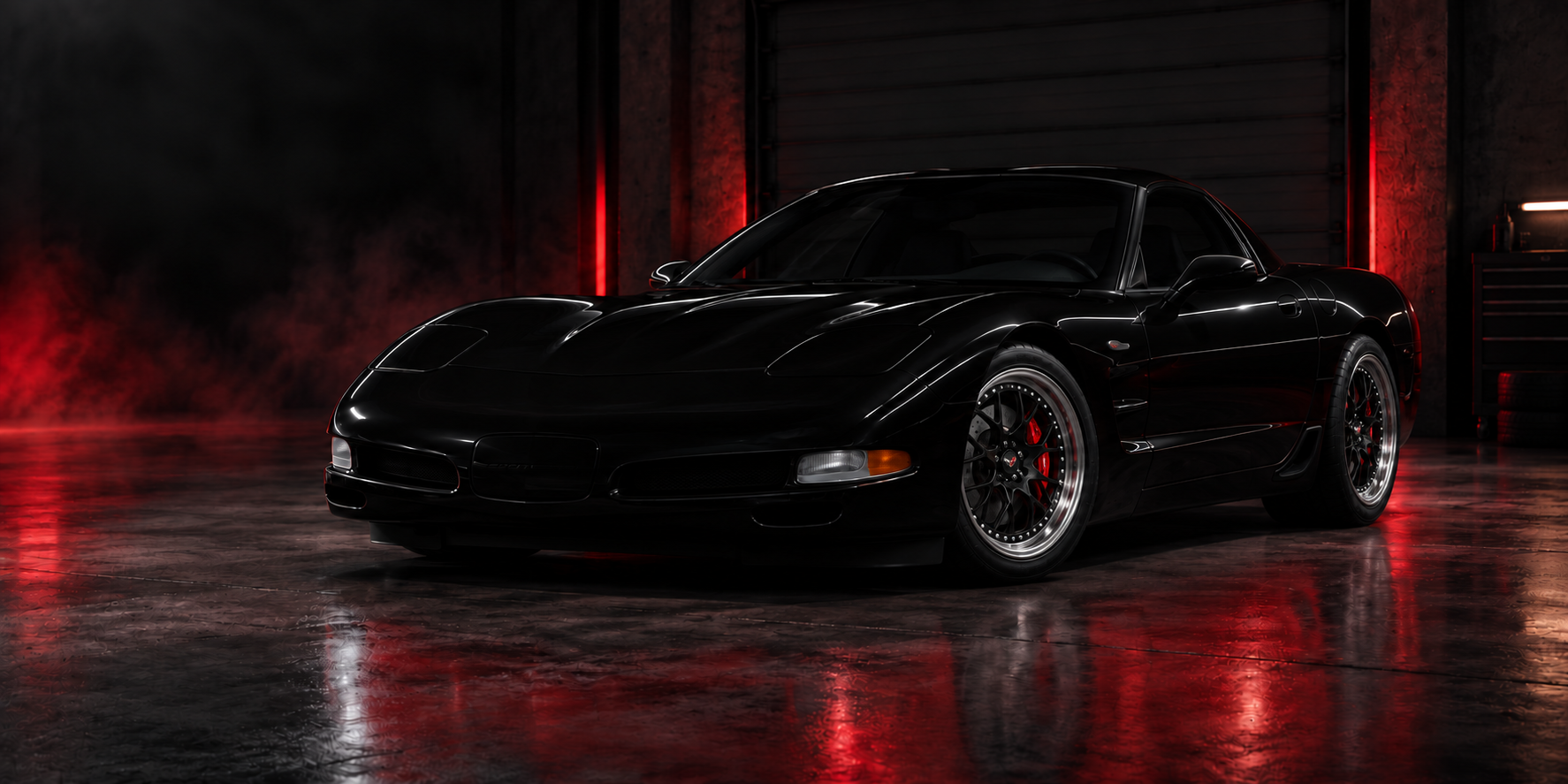 Stylized black 2001 Corvette Z06 named Robin in a dark garage with red accent lighting